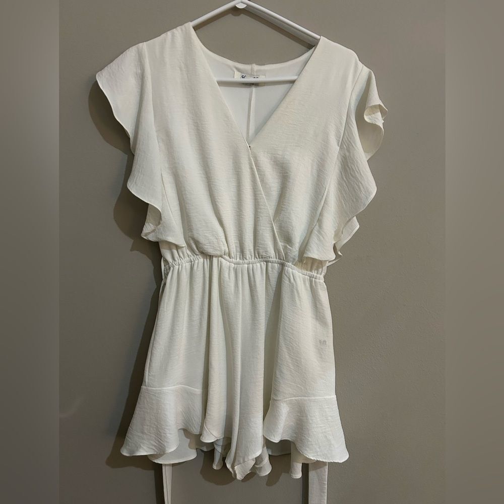 She+Sky White romper with v neck and ruffle sleeves